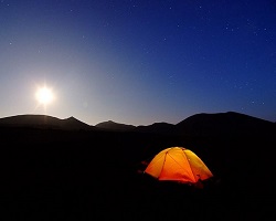 Tent lit up while camping