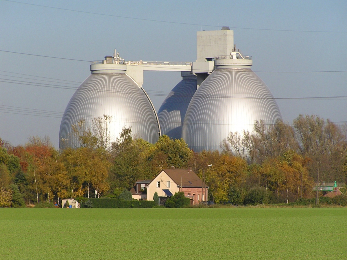 This is an image of a water treatment digestion tower in Germany. Digestion towers use bacteria in an oxygen-free environment to break down unwanted organic materials. Image credit Daniel Ullrich via Wikimedia commons. Picture of water treatment digestion towers in Germany.